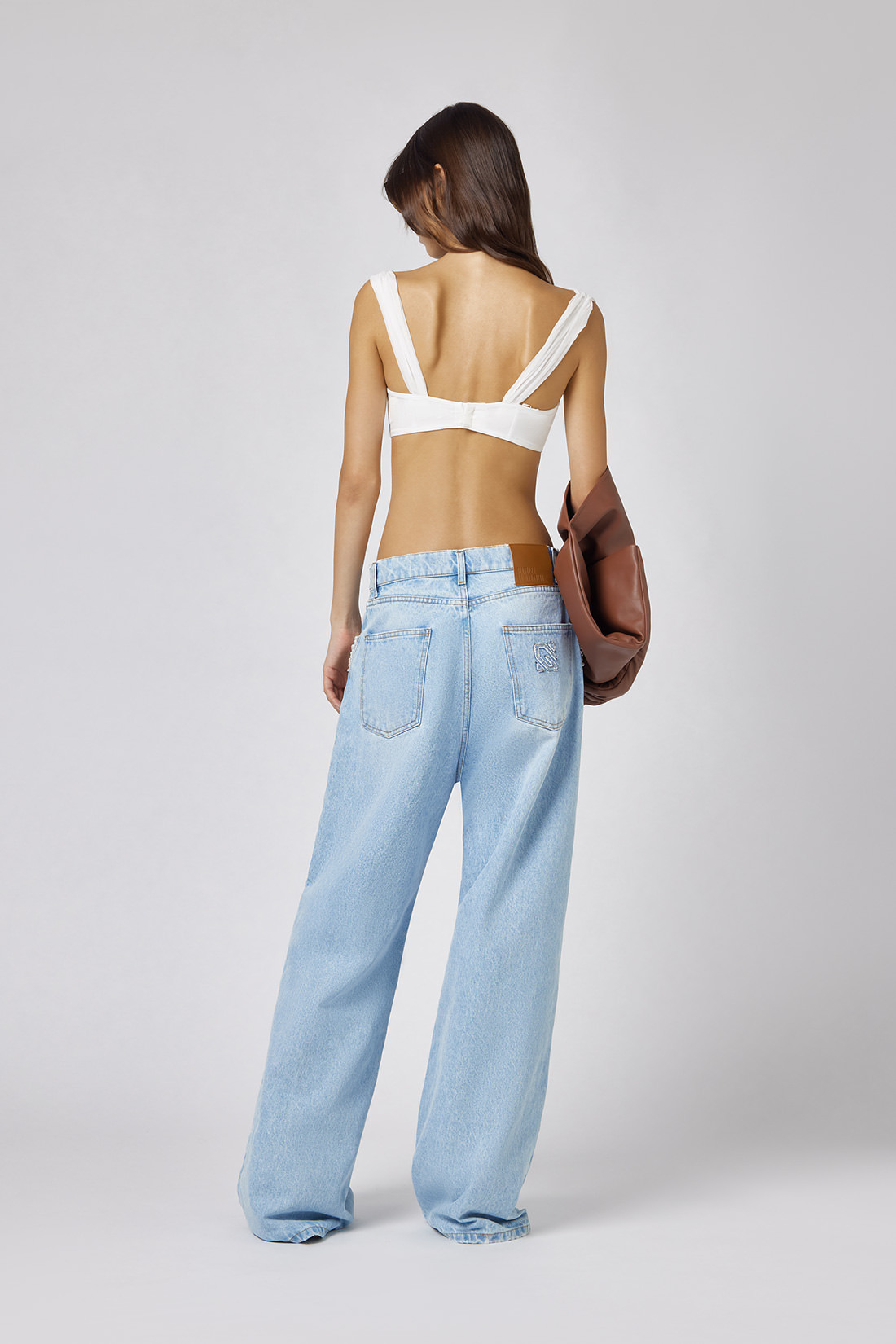 GIUSEPPE DI MORABITO: FIVE POCKET JEANS WITH PEARL DECORATIONS